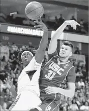  ?? Tony Gutierrez Associated Press ?? BAYLOR FORWARD Johnathan Motley and USC forward Nick Rakocevic compete for a rebound.