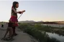  ?? AFP/Getty Images ?? Little Amal walks along the banks of the Rio Grande, in front of the United States border wall, in Chihuahua state, Mexico, on 26 October. Photograph: Hérika Martínez/