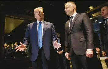  ?? MICHAEL M. SANTIAGO/GETTY ?? Former President Donald Trump meets with Poland’s President Andrzej Duda on Thursday at Trump Tower in New York City. Duda, a robust supporter of Ukraine, met with Trump to talk about NATO and Russia’s invasion.