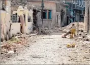  ?? Mohamad Abu Hamza Afp/getty Images ?? A DEBRIS-FILLED street in Homs, Syria, parts of which have been under siege for more than a year.