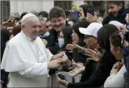  ?? ALESSANDRA TARANTINO — THE ASSOCIATED PRESS ?? Pope Francis salutes faithful in St. Peter’s Square at the Vatican before leaving after his weekly general audience, Wednesday, Feb. 26.