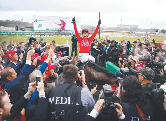  ??  ?? Jockey Kerrin McEvoy celebrates after Redzel won The Everest at Randwick this year. The race, now worth $14 million, will be run on Caulfield Cup day next year.