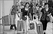  ?? YUYA SHINO/ REUTERS ?? Chinese tourists carry packages of Panasonic Corp's products along Tokyo’s Ginza shopping district.