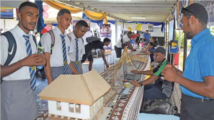  ?? Photo: Fiji National University ?? Nasinu Secondary School Year 12 trio Tevita Bainivalu, Josefa Naibe and Ethan Whippy were spotted admiring the building model and asking questions about its design. aa