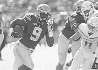  ?? STEVEN CANNON/AP ?? Florida State’s Jacques Patrick gets past Delaware State’s Brock Nichols to score during the first quarter.