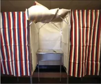  ?? A booth is ready for a voter at City Hall in Cambridge, Mass., on the first morning of early voting in the state. Intelligen­ce officials think Russian President Vladimir Putin may use the Biden admin's support for Ukraine as a pretext to order a new inter ??