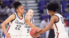  ?? Carmen Mandato / Getty Images ?? From left, UConn’s Evina Westbrook, Paige Bueckers and Christyn Williams react during Saturday’s game against Iowa.