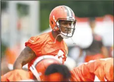  ?? Associated Press ?? Cleveland Browns quarterbac­k Deshaun Watson stretches during the NFL football team’s training camp, Monday, in Berea, Ohio. Watson was suspended for six games on Monday after being accused by two dozen women in Texas of sexual misconduct during massage treatments, in what a disciplina­ry officer said was behavior “more egregious than any before reviewed by the NFL.”