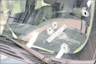  ?? [PHOTO COURTESY OF THE U.S. ATTORNEY’S OFFICE] ?? The Yukon Denali driven by detective Thurman Stallings was hit a dozen times by the Glock 17.