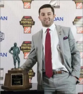  ?? JOHN AMIS — THE ASSOCIATED PRESS ?? Oklahoma quarterbac­k Baker Mayfield poses after winning the Maxwell Award during the College Football Awards show at the College Football Hall of Fame in Atlanta on Thursday.