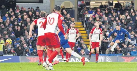  ?? AFP ?? Chelsea’s Eden Hazard, right, scores their third goal against West Brom at Stamford Bridge.