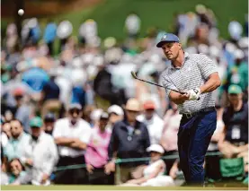  ?? Charlie Riedel/associated Press ?? Bryson Dechambeau took advantage of the early favorable conditions to record eight birdies en route to a 7-under 65 in the first round of The Masters.