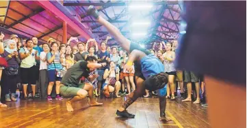  ??  ?? Capoeira practition­ers ‘play’ during a session at RWMF. Get ready for more Samba and Capoeira at WAK 2017.