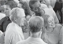  ?? Rogelio V. Solis / Associated Press ?? Former President George W. Bush takes a “selfie” with a group of AmeriCorps volunteers during a salute to first responders of Hurricane Katrina in last August in Gulfport, Miss.