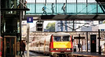  ?? — AFP photo ?? A London North Eastern Railway train approaches King’s Cross rail station in London. Britain’s historic rail industry is destined for the biggest shakeup in decades that could end in renational­isation and significan­t investment to vastly improve services amid costly fares and delays.