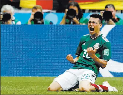  ?? Antonio Calanni ?? The Associated Press Mexico’s Hirving Lozano celebrates after scoring against Germany in a World Cup match Sunday in Moscow. Mexico went on to a 1-0 victory over the defending champions and now is in position to win Group F.