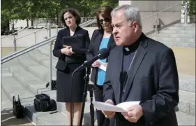  ?? AP PHOTO/JIM SALTER ?? St. Louis Archbishop Robert Carlson speaks at a news conference Monday announcing a federal lawsuit to stop a St. Louis ordinance that prohibits discrimina­tion based on “reproducti­ve health decisions.” The suit says the law enacted in February...