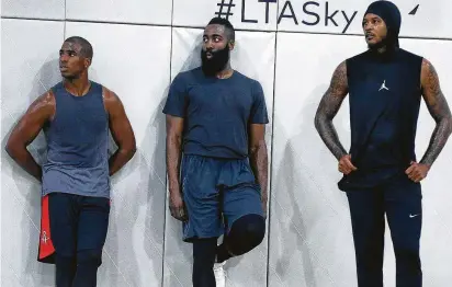  ?? Shareif Ziyadat / Getty Images ?? Chris Paul, left, James Harden, center, and Carmelo Anthony had a test run of playing together at an event last September, and now they’ll try it for real with the Rockets during the 2018-19 season.