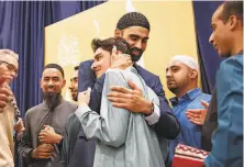  ?? Steve German / Special to The Chronicle 2019 ?? Hamid Hayat receives emotional greetings at an August event after his release from prison. He had been convicted in 2006, but the verdict was overturned in July. Federal prosecutor­s say they will drop the charges.