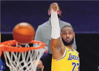  ?? MARK J. TERRILL/ASSOCIATED PRESS ?? LeBron James, pictured here during his Los Angeles’ Lakers overtime victory over Oklahoma City on Monday, is having one of his finest seasons at age 36. This is his 18th season in the NBA.