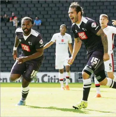  ??  ?? RAM RAID: Darren Bent, left, celebrates Derby’s late second goal roared on by Bradley Johnson