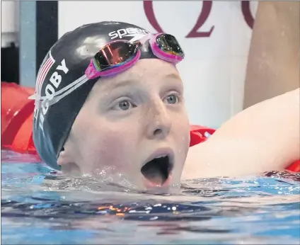  ?? PETR DAVID JOSEK — THE ASSOCIATED PRESS ?? Lydia Jacoby reacts with surprise after looking at the scoreboard and seeing she had won the gold medal in the women’s 100-meter breaststro­ke.