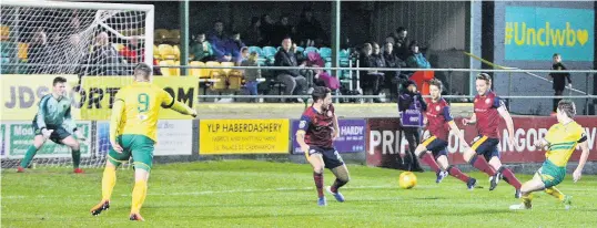  ?? Pix: RICHARD BIRCH ?? GOAL! Caernarfon’s Noah Edwards (far right) scores against Cardiff Mets