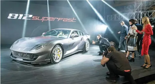  ?? PHOTOS: CONTRIBUTE­D ?? ◗ BRIGHT LIGHTS: The 2017 Ferrari 812 Superfast debuts in Melbourne and rightly attracts plenty of attention. The $610,000 supercar boasts Ferrari’s most powerful production engine ever: a 6.5-litre V12 boasting 588kW and 718Nm.