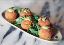  ?? ?? Farley's Fontina and Pumpkin Arancini comes with a flavorful aioli.