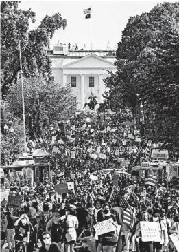  ?? SAMUEL CORUM/GETTY ?? Protesters stretch for blocks during demonstrat­ions Saturday near the White House.