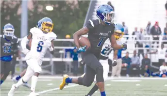  ?? ALLEN CUNNINGHAM/FOR THE SUN TIMES ?? Phillips’ Fabian McCray returns a kick against Simeon. Phillips is the No. 4 seed in 6A.