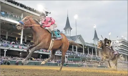  ?? Darron Cummings Associated Press ?? JOEL ROSARIO RIDES Game Winner to a convincing, come-from-behind victory over Knicks Go in the Breeders’ Cup Juvenile at Churchill Downs. Rosario also rode Juvenile Fillies winner Jaywalk to her fourth consecutiv­e victory.