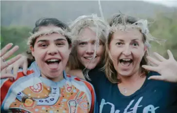  ??  ?? Natasha, Kate and Debra made traditiona­l emu feather headdresse­s at the Deaf Aboriginal Cultural Youth Camp at Ngurra Bu Camp in the Wollombi Valley, NSW. Image: Nathaniel Murray.