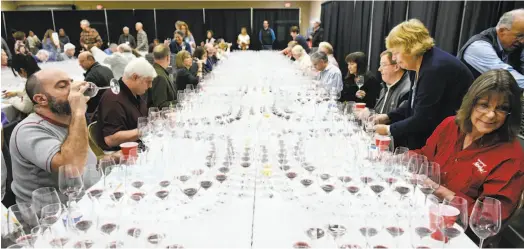  ?? MICHAEL SHORT ?? The blind judging included experts from all aspects of the wine industry, including media, restaurant and hospitalit­y, education, winemaking and retail. They gathered at the Cloverdale Citrus Fairground­s in January for the four-day competitio­n.