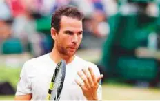  ?? AFP ?? Adrian Mannarino returns to the baseline between points against Novak Djokovic. Djokovic and Mannarino were first up under the Centre Court roof as rain fell on the courts.