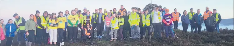  ?? ?? A great turnout for the Darkness into Light Walk on Saturday morning last from those in Ballysagga­rt, who trekked to ‘The Stoney Man’ and watched a beautiful sunrise over the Knockmeald­own Mountains.