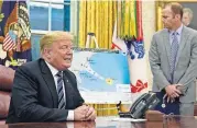  ?? [AP PHOTO] ?? President Donald Trump, left, talks about Hurricane Florence during a briefing Tuesday in the Oval Office of the White House in Washington. At right, FEMA Administra­tor Brock Long listens.