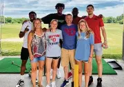  ?? CONTRIBUTE­D ?? Dayton basketball players (back row from left) Malachi Smith, Daron Holmes II, R.J. Blakney and Koby Brea pose with fans at Young’s Jersey Dairy in Yellow Springs earlier this month.