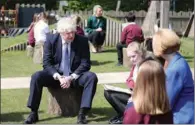  ?? (AFP) ?? Britain’s Prime Minister Boris Johnson (left) visits Cleves Cross Primary school in Ferryhill, northeast England on Thursday.