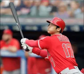  ?? AP PHOTO/TONY DEJAK ?? Los angeles angels’ shohei Ohtani watches his two-run home run off cleveland indians starting pitcher Mike clevinger during the first inning of a baseball game on Friday, in cleveland.