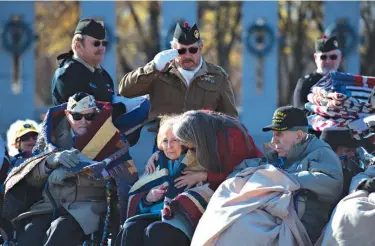  ??  ?? above
n Kathleen Chavez, left, talks Wednesday with her father, Ray Chavez, right, age 104, of the USS Condor, the oldest living survivor from the Pearl Harbor attacks. They had gathered along with the remaining survivors of the USS Arizona at the...