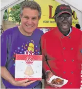  ?? MAUREEN SCHULMAN ?? Marc Schulman (left) and Charlie Robinson have been serving up some of Taste of Chicago’s most popular dishes for decades.