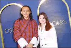  ?? AFP ?? Bhutanese filmmaker Pawo Choyning Dorji (left) arrives at the 94th Annual Oscar Nominees Luncheon.