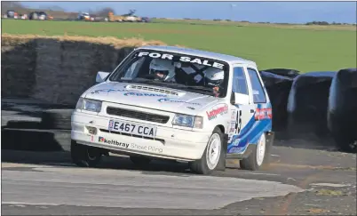  ?? Words and pictures by Gavin Brown, West Coast Photos. ?? Jamie Miller and Ian McCulloch with their Vauxhall Nova.