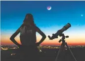  ?? GETTY IMAGES ?? A telescope, binoculars or just a look skyward can provide a different sort of visit to faraway places.