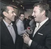  ??  ?? NICK MELVOIN, right, chats with former Mayor Antonio Villaraigo­sa on election night. Melvoin won with backing from wealthy charter school supporters.