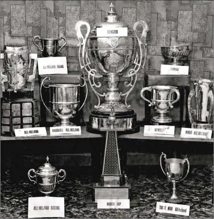  ??  ?? This marvellous photograph adequately conveys the sheer depth of Wexford’s success in 1968. As well as the various hurling and camogie trophies, it includes the handball cup won by Joe Howlin, Dick Lyng, Seamus Buggy and Jimmy King, the All-Ireland tug o’war trophy collected by Boley, and the boxing silverware that returned to the county.