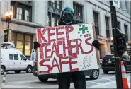  ?? ASHLEE REZIN — CHICAGO SUN-TIMES VIA AP ?? Adan Meza, 29, a teacher at Benito Juarez High School, poses for a photo as he protests with other members of the Chicago Teachers Union and supporters while the union stages a car caravan protest outside City Hall in the Loop, Wednesday.