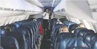  ?? JIM URQUHART/REUTERS ?? A plane is nearly empty during a Delta flight departing from Salt Lake City, Utah last month. For the travel and airlines industry, a full recovery from the COVID-19 fallout is expected to take years.