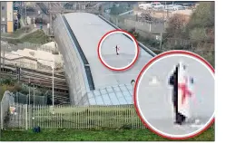  ??  ?? TRAIN STOPPER: The man (circled) with flag on the bridge roof